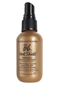 Bumble and bumble Heat Shield, flacon vaporisateur de 60 ml avec une finition dorée métallique, un bouchon de pompe noir et un motif hexagonal. Contient une formule de protection thermique.