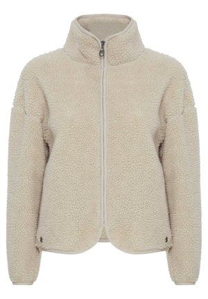 Fleece-takki vaaleassa beessissä, jossa on korkea kaulus, etuvetoketju ja pyöreä helma. Rakennepinta ja rento istuvuus pitkillä hihoilla.