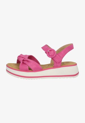 Roze suède sandalen met een geknoopt ontwerp aan de voorkant, verstelbare enkelband en een witte platformzool met een roze accentlijn.
