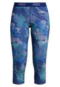 Modré a zelené vzorované Nike zkrácené legíny s bílým tečkovaným designem a logem Nike na pase a stehně.
