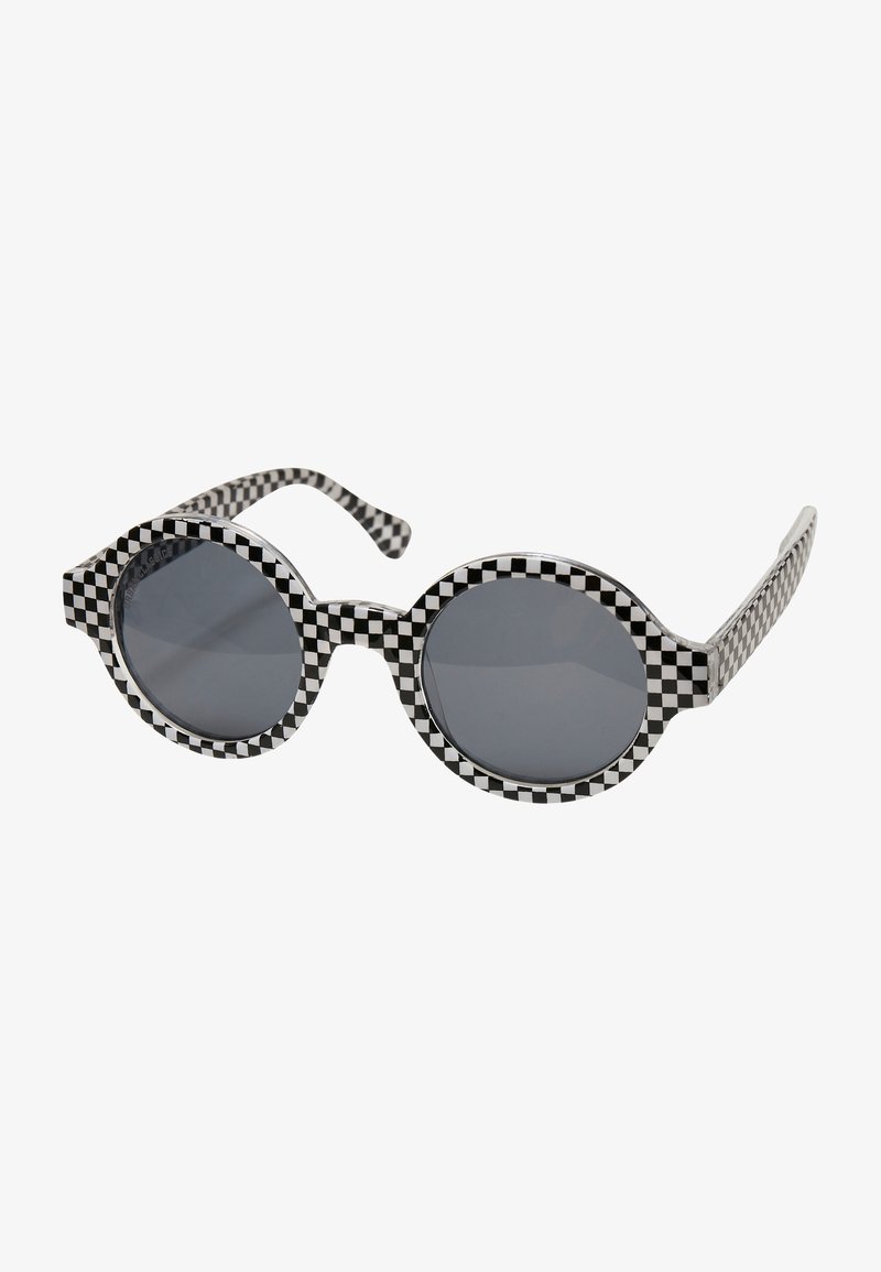 Black and white checkered sunglasses with round lenses, thick frame, and patterned temples. Dark, tinted lenses provide sun protection.