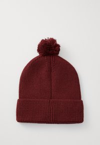 Dark red knitted beanie with folded cuff and pom-pom on top, displayed flat on a white background.