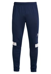Marineblauwe sportbroek van lichtgewicht stof met een elastische tailleband. Bevat witte accenten aan de onderzijde en een fitted silhouet.