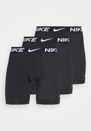 Musta puuvillasekoitemateriaali bokserit, joissa on laiha elastne vöö, millel on "NIKE" logo, sujuv tekstuur ja keskmise reie pikkus. Kolme tükki pakis.