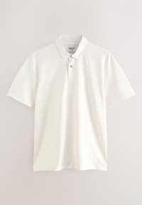 Polo blanc à manches courtes avec col et patte à deux boutons, marque Next, taille moyenne, coupe régulière, présenté sur un fond uni.