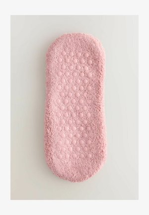 Ružová textúrovaná vaňová predložka s plyšovým povrchom a vyvýšenými kruhovými akcentmi pre lepšiu priľnavosť, s okrúhlymi hranami a jemným vzhľadom.