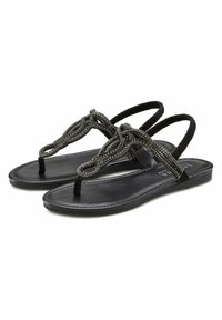 Black sandals with a flat sole, featuring decorative beaded straps and a toe post design. The straps are intricately woven, offering a textured detail.