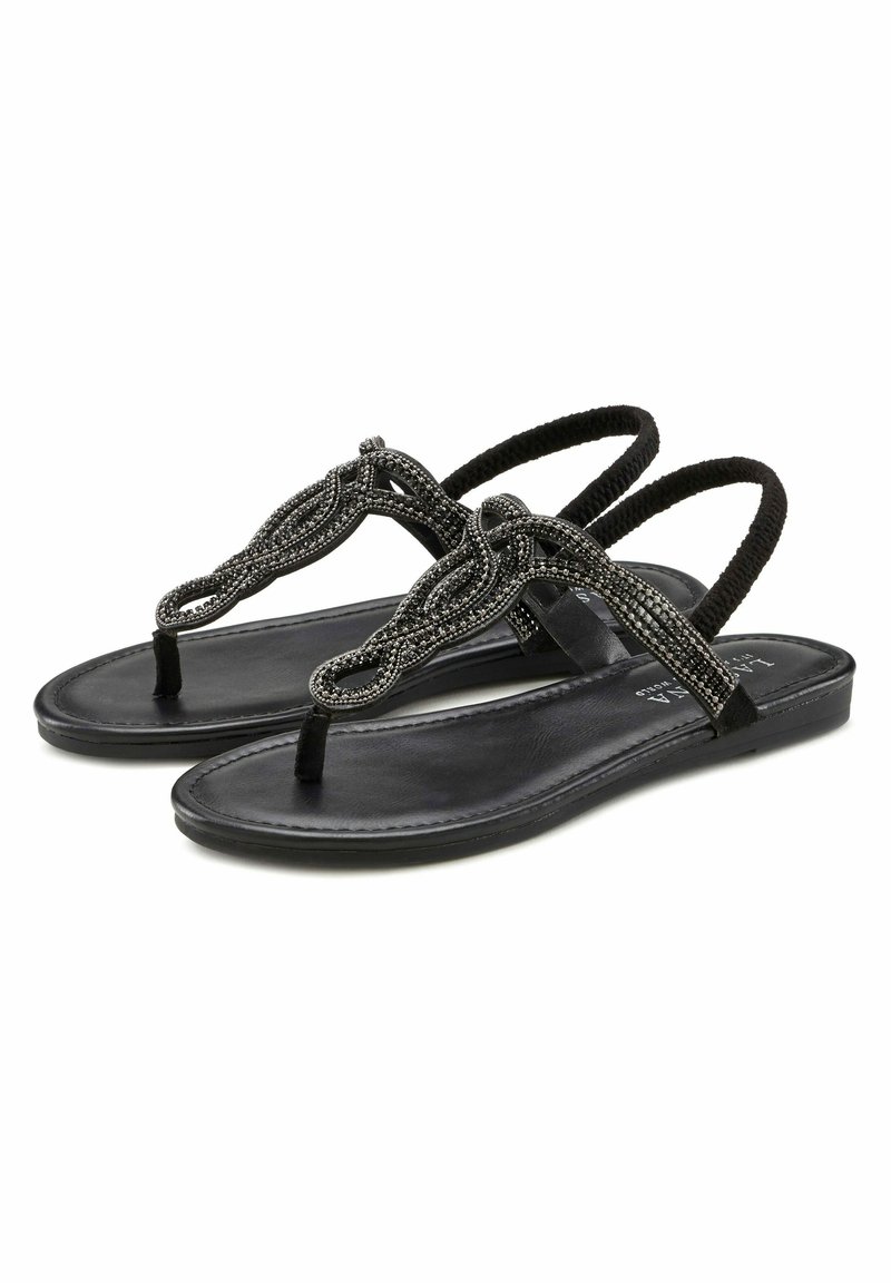 Black sandals with a flat sole, featuring decorative beaded straps and a toe post design. The straps are intricately woven, offering a textured detail.