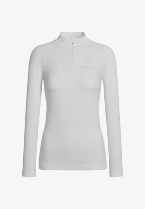 Maglia bianca a maniche lunghe con colletto alto e mezza cerniera. Presenta una texture a coste e un design aderente, con un logo discreto al centro.