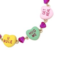 Heart-shaped necklace featuring pastel-colored charms with inscriptions, linked by gold chain, accented with purple acrylic hearts.