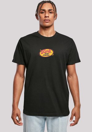 Black cotton t-shirt featuring a colorful "King of Dad Jokes" graphic in yellow and red on the chest, relaxed fit, short sleeves.