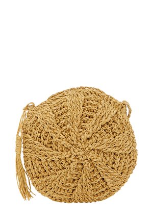 Runde, geflochtene Strohtasche in einem hellen Tan-Farbton. Mit einem strukturierten, geflochtenen Muster und einem seitlichen Quastendetail.