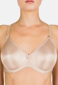 Reggiseno imbottito beige con texture satinata liscia, supporto con ferretti, spalline regolabili e piccoli fiocchi nei punti di giunzione delle spalline e al centro.