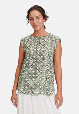 Short-sleeved top in green and white patterned fabric, featuring a scoop neck with a small keyhole detail, relaxed fit.