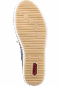 Semelle de chaussure en caoutchouc avec un motif ondulé, couleur beige avec des accents circulaires en relief, et un logo rouge incrusté près du talon.