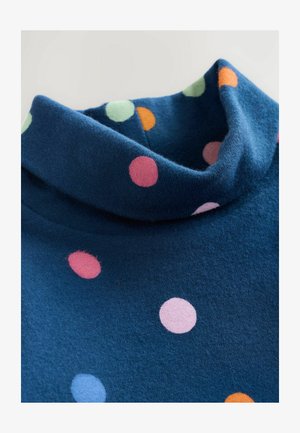 Pull en col roulé bleu marine avec une texture douce, orné de points multicolores éparpillés en rose, vert, orange et bleu.