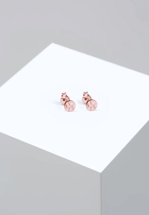 Roségold Ohrstecker mit rundem, kristallähnlichem Design und Sternenstrahl-Muster. Glatte Textur auf der polierten Oberfläche.
