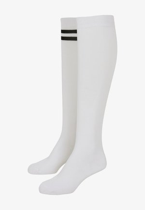 White knee-high socks made of a smooth fabric with black horizontal stripes at the top. Features a ribbed cuff for enhanced fit.