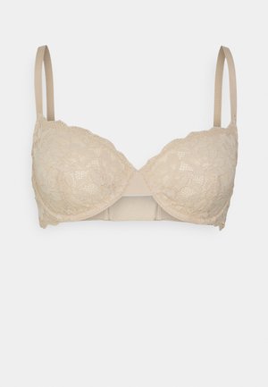 Beige lace bra with padded underwire cups, adjustable straps, and scalloped edges. Smooth back band enhances support and comfort.