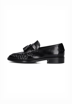 Black leather loafers with a shiny finish, featuring a braided accent on the toe and a low, block heel. Smooth texture.
