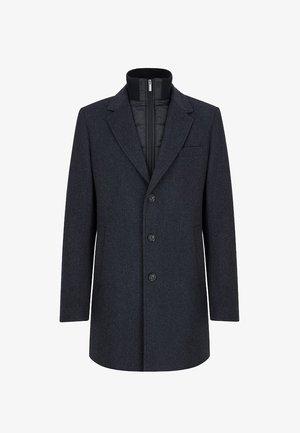 Czarny szary płaszcz z wełny z prostym krojem, z klapami w kształcie notcha, jednym zapięciem i zamkiem błyskawicznym wewnętrznej podszewki. Posiada kieszenie z przodu.