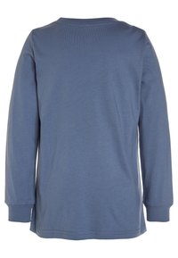 Långärmad skjorta i mjuk, enfärgad blått tyg. Rund hals, rak skärning, med avsydda ärmar och nederkant, och en slät textur.