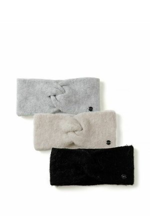 Trois bandeaux tricotés en gris, beige et noir, chacun avec un nœud torsadé au centre et une petite étiquette ronde avec le logo.