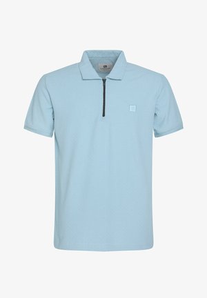 Heledsinine lühikeste varrukatega polo särk, millel on pooltõmblukuga kaelus, kangas on tekstuuriga ning vasakul rinnal on väike logo.