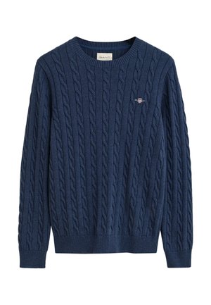 Maglione lavorato a maglia blu navy con texture a trecce, polsini a coste e scollatura a girocollo. Piccolo logo ricamato sul petto.