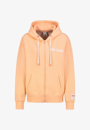 Perzikkleurige hoodie met voorsluiting, zijzakken, witte tekst "oui chérie" en contrasterende trekkoorden met afgekroonde uiteinden. Zacht materiaal.
