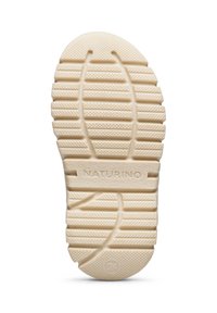 Sole boty v bílé gumě s texturovanými vzory a drážkami pro trakci, s vyraženým nápisem "NATURINO" a velikostí "24".