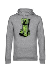 Sudadera gris con un gráfico de un personaje de bloques verde con acentos en negro. El diseño incluye patrones de texto y un acabado texturizado.