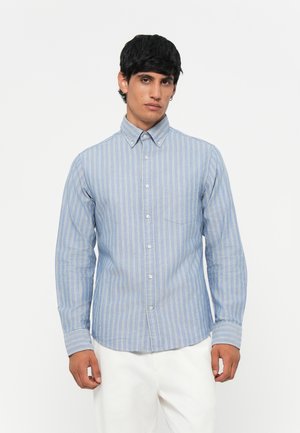 Blue striped button-up shirt made of lightweight fabric, featuring a collar, a chest pocket, and contrasting white stripes.