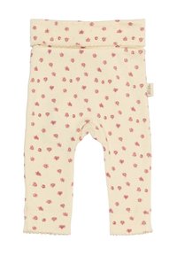 Leggings de crema claro con pequeño estampado floral en rosa, material de algodón suave, cinturilla elástica y borde ondulado en los tobillos.