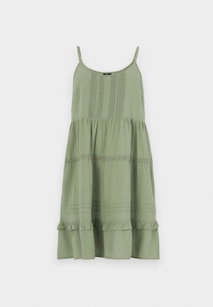 Green sundress with spaghetti straps, tiered design. Features textured detailing along the bodice and ruffled hem at the bottom.