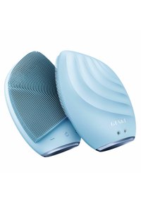 Dispositif de nettoyage facial bleu clair avec des poils texturés, une forme ergonomique et des accents de surface lisse. Comprend des boutons et des indicateurs LED.