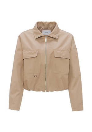 Giacca beige tagliata con colletto stand, zip frontale, due tasche sul petto e orlo arrotondato. Tessuto liscio con finitura opaca.