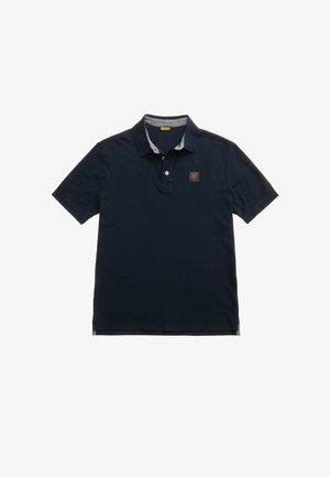 Polo shirt blu navy in cotone. Dotato di una patta con tre bottoni e di una toppa con logo sul petto. Dettagli a contrasto all'interno del colletto.
