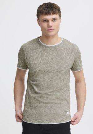 Olive green textured t-shirt with a crew neckline, short sleeves, and white accents at the collar and sleeve hems. Small brand label at hem.