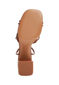 Brown high-heeled sandal with a square toe, strappy design, textured sole, and a sturdy block heel. Features rubber traction for grip.