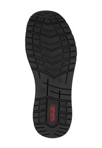Suela de zapato de goma negra con un patrón de banda de rodadura en zigzag, superficie texturizada y un logo rojo en el centro. Forma plana con surcos pronunciados.