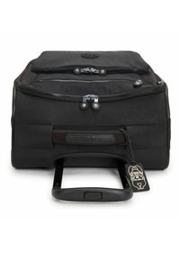 Black wheeled bag featuring two zippers, a sturdy handle, smooth texture, and a small decorative tag with a character design.