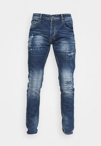 Tmavě modré džíny z denimu se slim fit střihem, oblékáním a odřenými detaily. Obsahují kontrastní prošívání a standardní pětikapsový design.