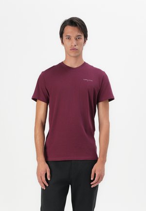 T-shirt en coton bordeaux à manches courtes et col rond. Doté d'un petit logo blanc sur la poitrine gauche. Coupe lisse et décontractée.