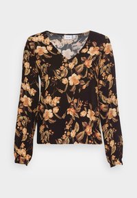 Blusa nera floreale con maniche lunghe, scollatura a V, con grandi fiori beige e arancioni e foglie verdi su un tessuto liscio.