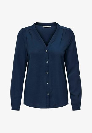 Chemise bleu marine à manches longues avec col en V, design plissé et boutons argentés. Texture douce avec une coupe décontractée.