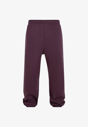 Lila Jogginghose aus weichem Stoff mit einem elastischen Bund, schmal zulaufendem Bein und gerippten Bündchen an den Knöcheln.