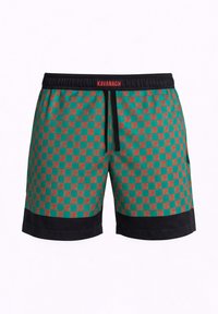 Grüne und rote karierte Schwimmshorts für Herren mit schwarzem Bund und Saum, mit "KAVANAGH" in Rot am Bund geprägt.