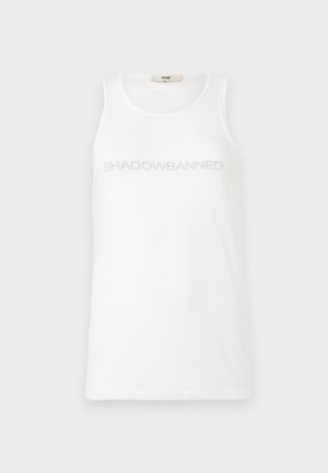 White tank top made of soft fabric. Features the text "SHADOWBANNED" in light gray across the chest. Simple, sleeveless design.