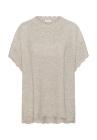 Pull en tricot beige clair avec un col en dentelle et des manches courtes. Orné de petites perles sur le devant supérieur. Texture douce.